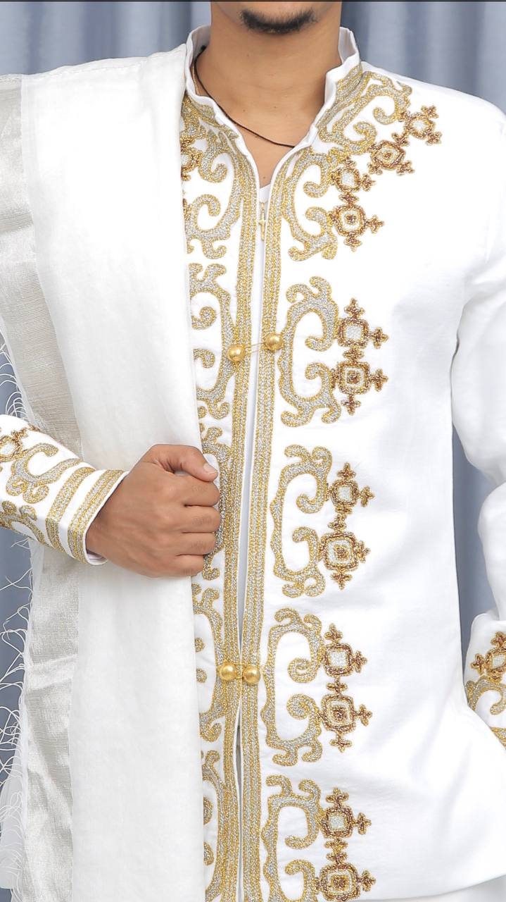 White and gold Habesha gown detail